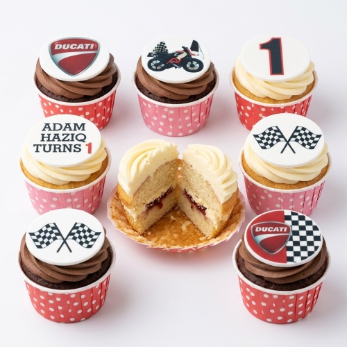 Cupcakes with Ducati logo, motorcycle, racing flags, and custom age topper.