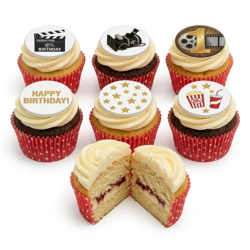 A selection of movie theme birthday cupcakes with clapperboard, camera, film reel, popcorn, stars, and 'Happy Birthday' toppers.
