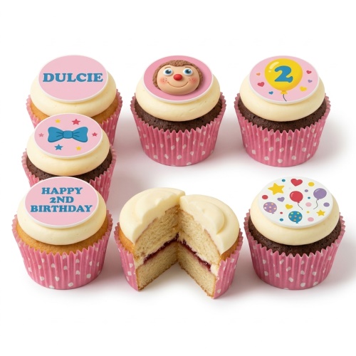 Selection of Mr Tumble themed birthday cupcakes with character, bow tie, balloons, and custom message toppers in pink wrappers.