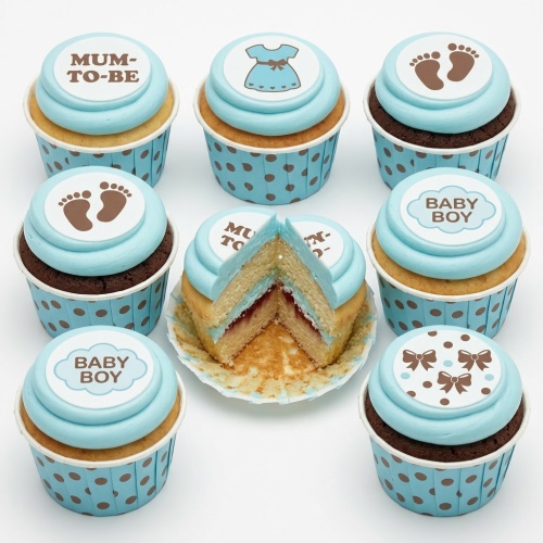 Baby shower cupcakes with blue frosting, baby footprints, baby dress, Mum-to-Be, and Baby Boy toppers.