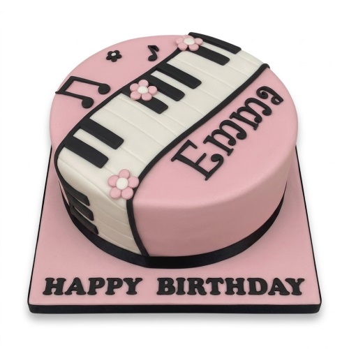 Round pink birthday cake with a piano keyboard design, musical notes, and small pink flowers.