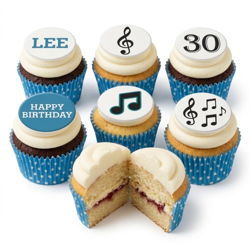 Music notes birthday cupcakes with white frosting, blue polka dot cases, and custom age and name toppers.