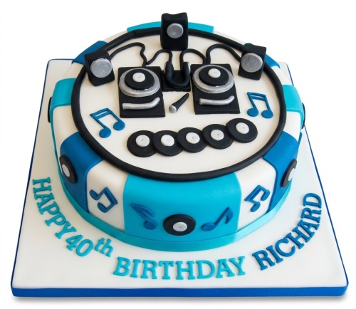 Round DJ music theme birthday cake with turntables, speakers, headphones, and musical notes in blue and white.