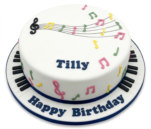 White round birthday cake with colourful musical notes, a treble clef, and piano keys around the base.