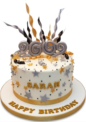 Round white birthday cake with gold and silver stars, black dots, and festive swirls. Features a custom age topper and a personalised name.