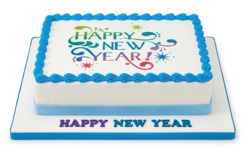 Rectangular white cake with blue border and "Happy New Year!" colourful edible print.
