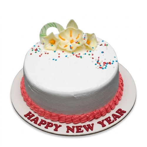 Round white Happy New Year cake with red piping, sugar flowers, and sprinkles.