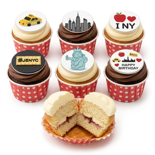 Cupcakes with New York City themed toppers including a yellow taxi, skyline, Statue of Liberty, and I love NY apple.