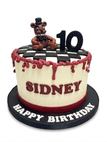 Round Five Nights at Freddy's cake with Freddy Fazbear topper, checkerboard, red drips, and custom age.