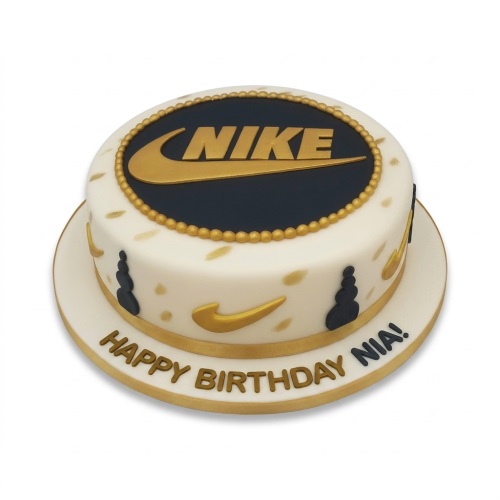 Round white cake with gold Nike logo, black and gold accents, and personalised birthday message.