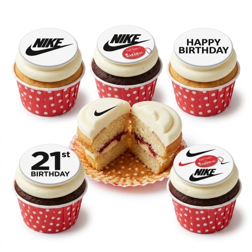 Vanilla and chocolate cupcakes with white frosting, red polka dot wrappers, and edible Nike logo toppers. One cupcake has a 'Happy Birthday' topper and another a '21st Birthday' topper.