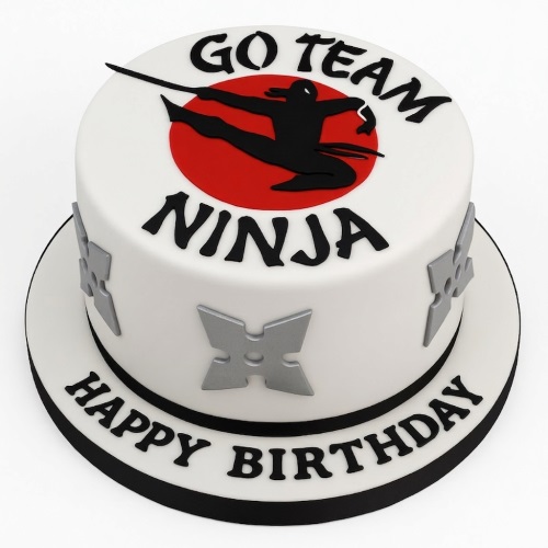 White birthday cake with black ninja silhouette on red circle and silver ninja stars.