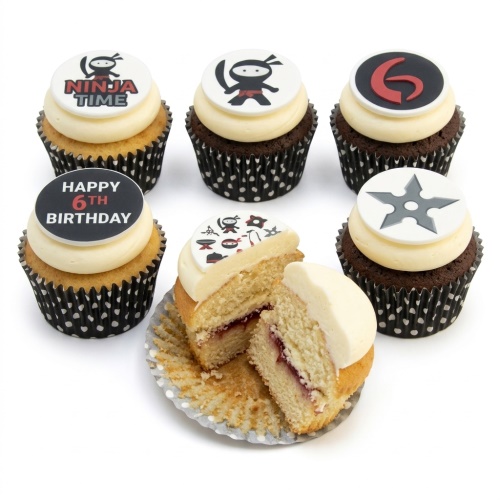 Ninja themed cupcakes with various toppers including a ninja character, ninja star, and a 'Happy Birthday' message.