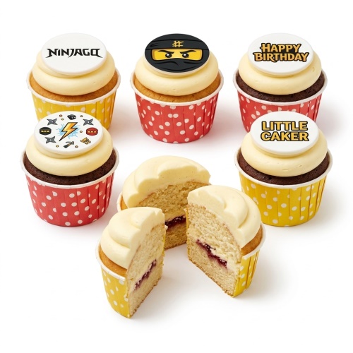 Ninjago themed cupcakes with character and logo toppers, red and yellow cases.