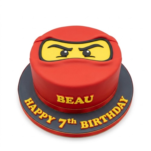 Red Lego ninja character birthday cake with custom name and age message.