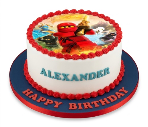 White round cake with Lego Ninjago edible image, red piping, and personalised name and message.
