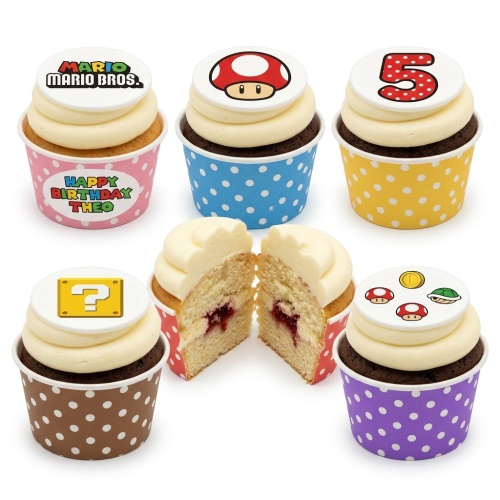 A selection of Super Mario Bros. themed cupcakes with custom age and personalised message toppers, featuring game characters.