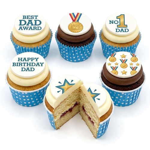 Six cupcakes with white and chocolate frosting, blue polka dot wrappers, and 'Best Dad Award', 'No.1 Dad', 'Happy Birthday Dad' toppers.