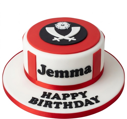 Round red and white birthday cake with a black crest featuring a white rose and crossed symbols, and personalised name.