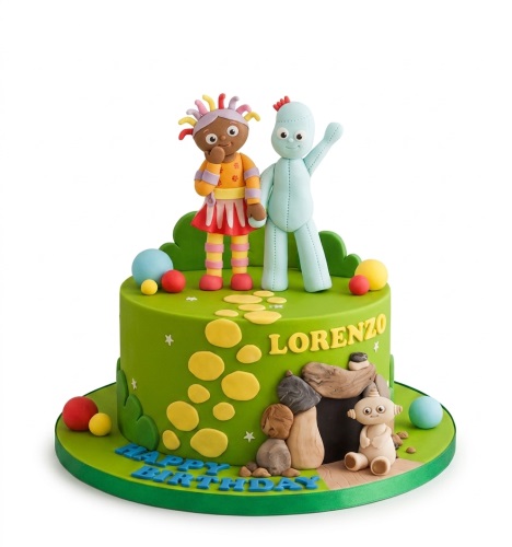 Green In the Night Garden birthday cake with Upsy Daisy and Igglepiggle fondant figures, colourful balls, and stepping stones.