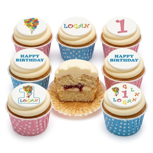 Cupcakes with white frosting, multi-coloured balloon designs, a pink number 1, and custom name toppers, in pink and blue polka dot wrappers.