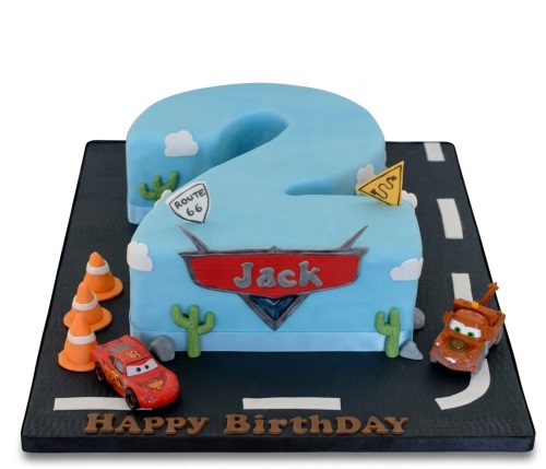 Light blue number 2 cake with Cars characters Lightning McQueen and Mater, traffic cones, and road details.