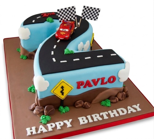 Number shaped cake with Lightning McQueen, racing road, checkered flags, and custom age.