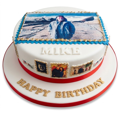 Round white fondant cake with edible photos, red ribbon, blue and gold borders, and 'Happy Birthday' text.