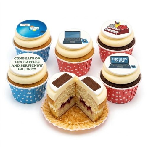 Cupcakes with corporate logos, laptops, office supplies, and chocolate bar toppers.