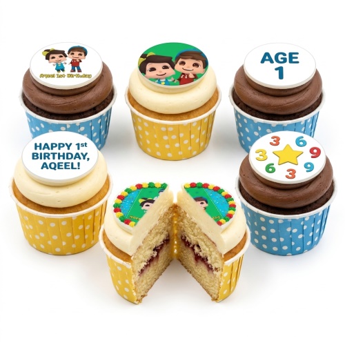 Kids 1st birthday cupcakes with cartoon character toppers and number 1 decoration.