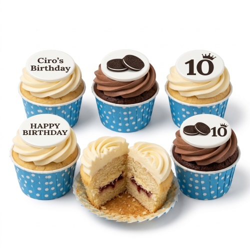 Six birthday cupcakes with blue polka dot wrappers, white and chocolate frosting, some topped with Oreo cookies, and others with custom message toppers.