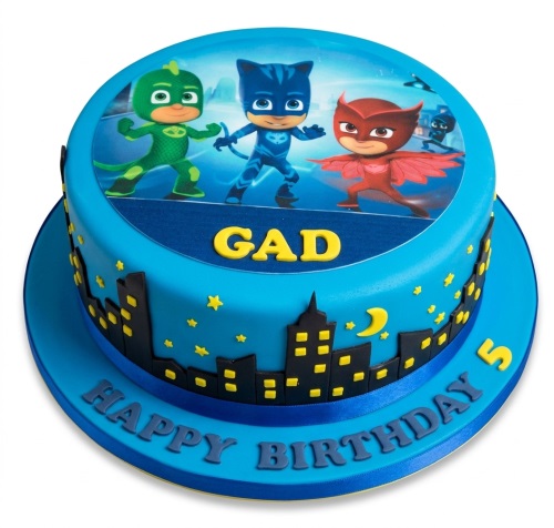 Round blue PJ Masks birthday cake with Catboy, Owlette, Gekko, city skyline, and custom age.