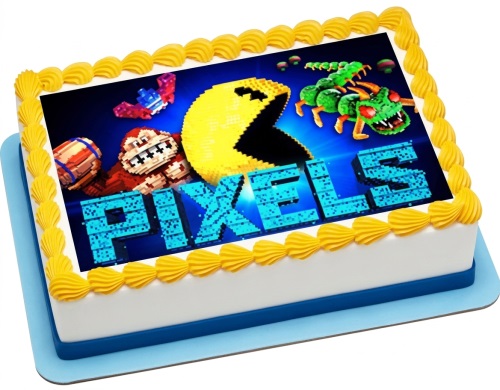 Rectangular white cake with yellow piped icing border and a Pixels movie gaming edible image topper.