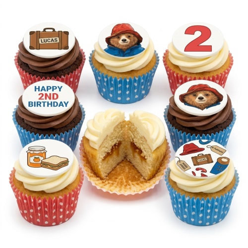 Paddington Bear themed cupcakes with custom age topper, suitcase, and marmalade sandwich decorations.