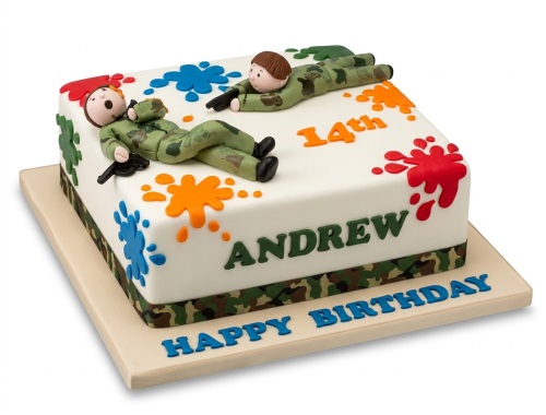 Square paintball theme birthday cake with two fondant figures in camouflage, paint splatters, and custom age.