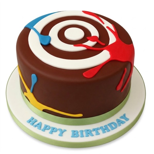 Round brown birthday cake with a white target and red, blue, yellow paint splatters.