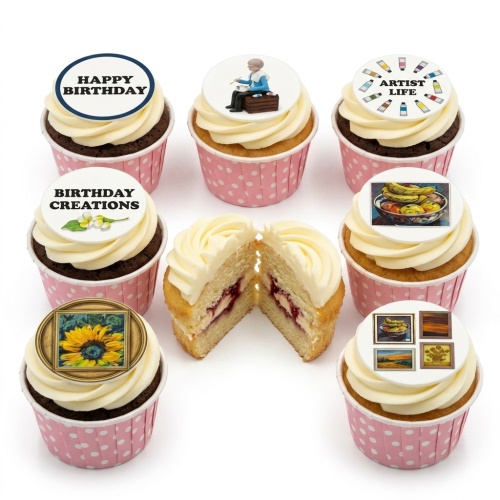 A selection of cupcakes with white frosting and pink polka dot wrappers, decorated with edible toppers featuring art-related images and "Happy Birthday" text.