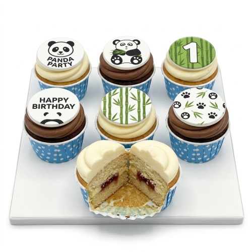 Panda themed birthday cupcakes with bamboo, paw prints, and custom age topper.