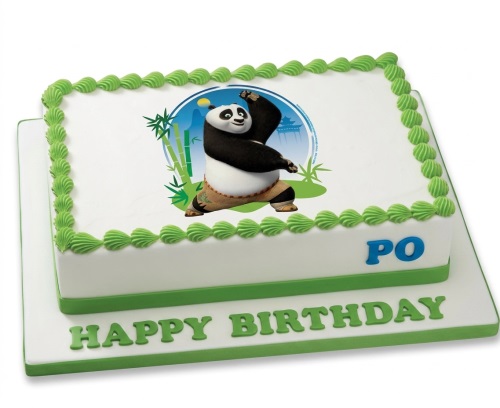 Rectangular white birthday cake with green piping and an edible image of Kung Fu Panda's Po.