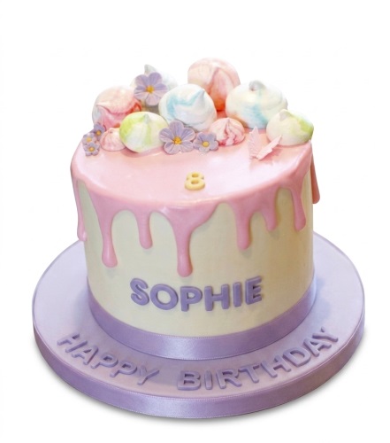 Pastel pink drip birthday cake with meringue kisses, sugar flowers, and a butterfly, with custom age.