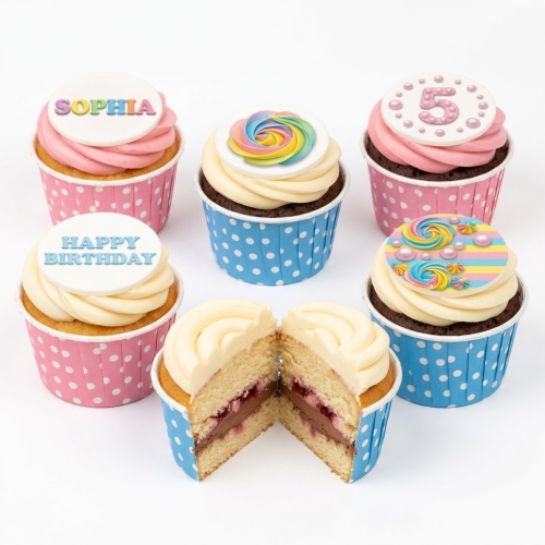 Colourful rainbow birthday cupcakes with custom age and name toppers.
