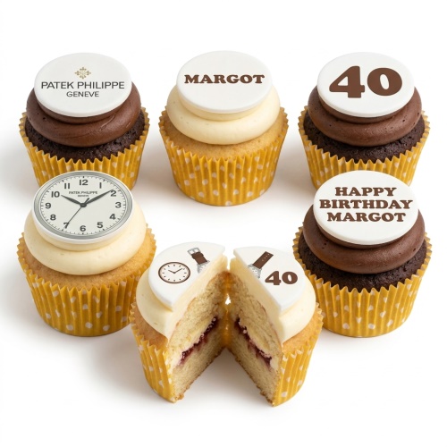 A selection of watch theme birthday cupcakes with Patek Philippe and clock face toppers, some with vanilla and some with chocolate frosting, and a custom age topper.
