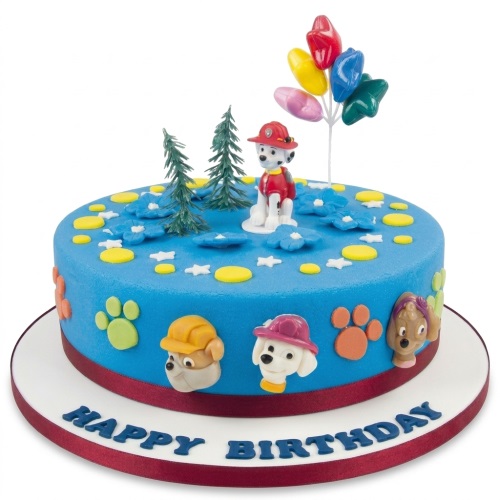 Round blue Paw Patrol birthday cake with Marshall, Rubble, Skye, paw prints, trees, and balloons.