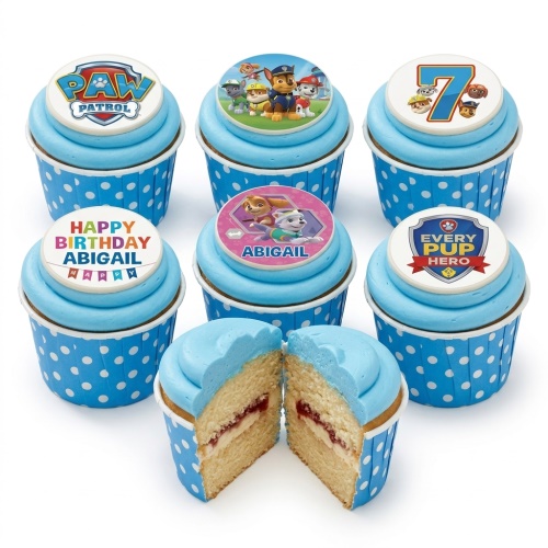 Paw Patrol themed cupcakes with blue frosting, polka dot wrappers, and custom age and name toppers.