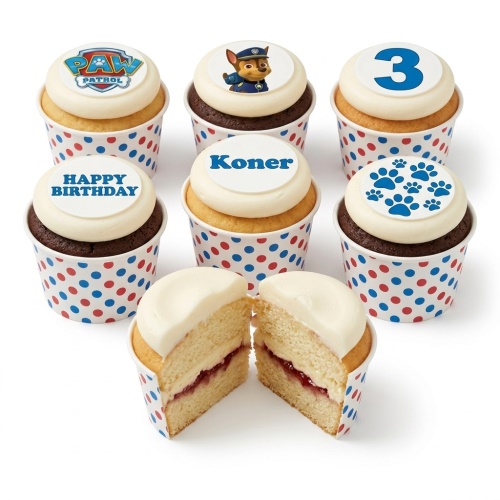 Paw Patrol themed birthday cupcakes with Chase, paw prints, and custom age and message toppers in polka dot wrappers.