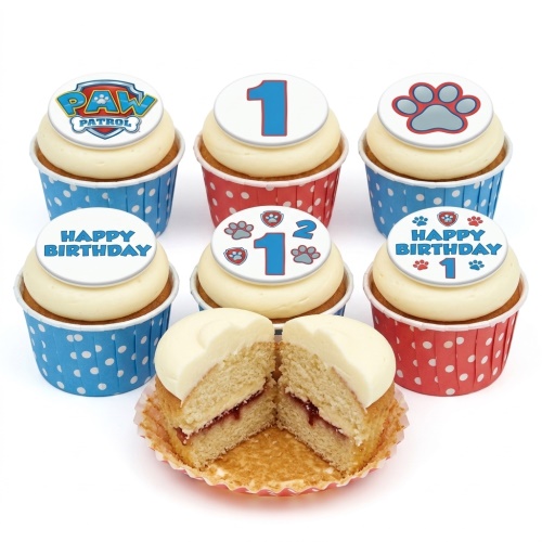 Paw Patrol 1st birthday cupcakes with red and blue polka dot cases, paw print toppers, and number one.