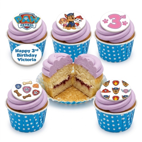Paw Patrol themed cupcakes with purple frosting, blue polka dot cases, and edible character toppers.