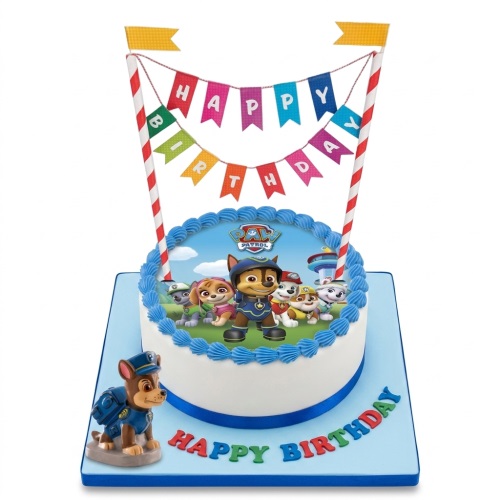 Round white Paw Patrol birthday cake with blue trim, edible character image, 'Happy Birthday' banner, and a Chase figurine.