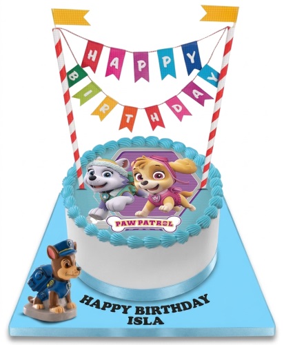 Round Paw Patrol birthday cake with Everest, Skye, and Chase figurine on a blue board.