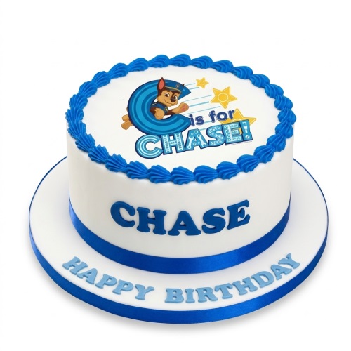 Round white Paw Patrol Chase birthday cake with blue trim and custom name.